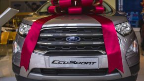 A ribbon sits on the hood of a Ford EcoSport SUV