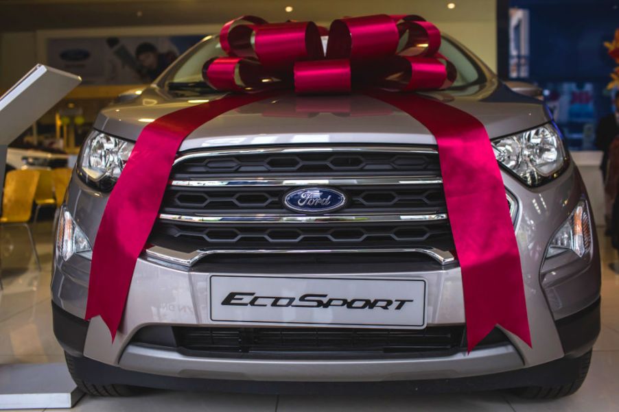 A ribbon sits on the hood of a Ford EcoSport SUV