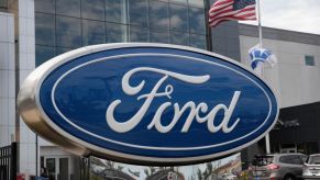 A large Ford sign on display outside one of the company's facilities.