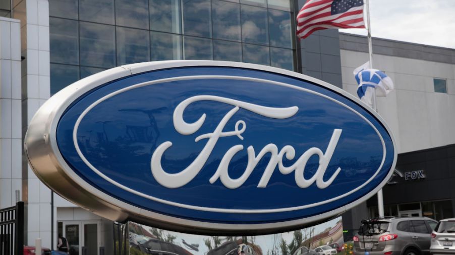 A large Ford sign on display outside one of the company's facilities.