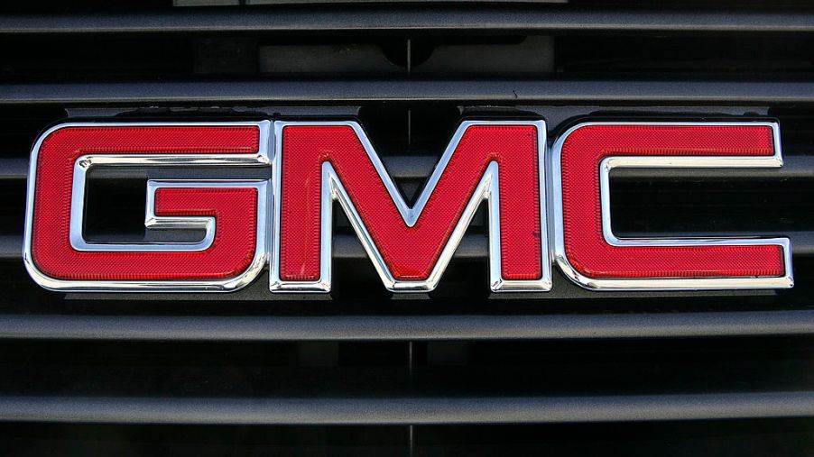 A GMC logo on the grill of a pickup truck