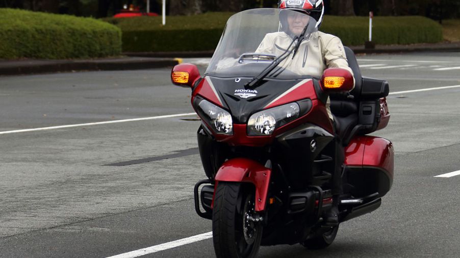 A man riding a Honda Gold Wing touring motorcycle