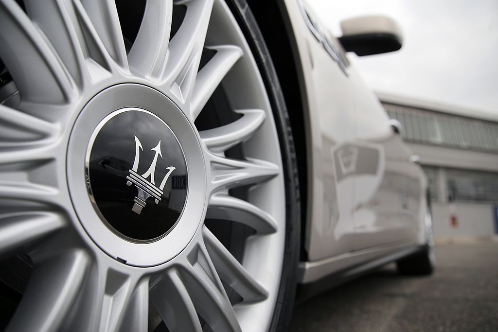 Maserati logo on the wheel of a car.