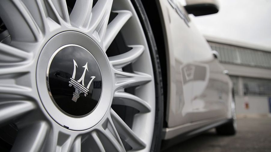 Maserati logo on the wheel of a car.