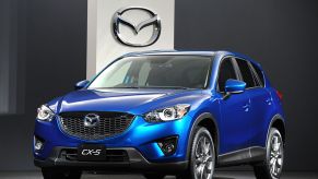 A blue Mazda CX-5 on display at a car show
