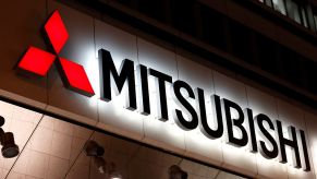 An illuminated Mitsubishi sign
