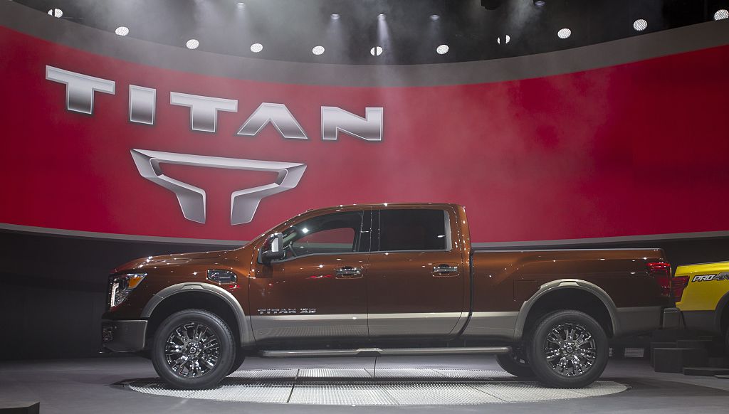 A Nissan Titan truck on display at an auto show.