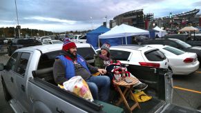 Tailgaters Brian Kovalski and his wife Christina tailgate in their pickup truck