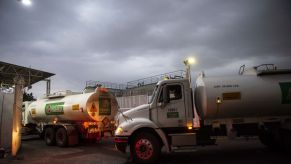 Semi-trucks fill up with fuel