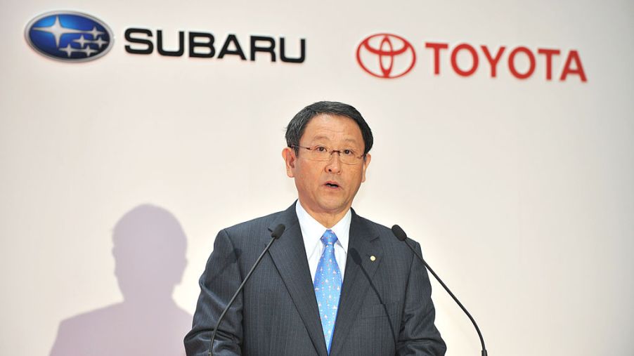 Toyota's president making an announcement about a partnership with Subaru