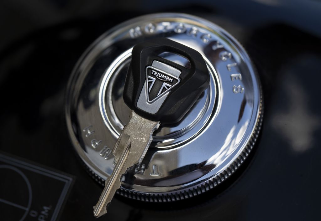 The logo of Triumph on a motorcycle key