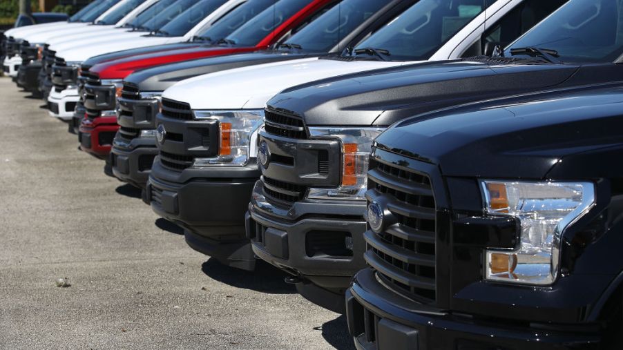 A lineup of Ford truck in all different colors.