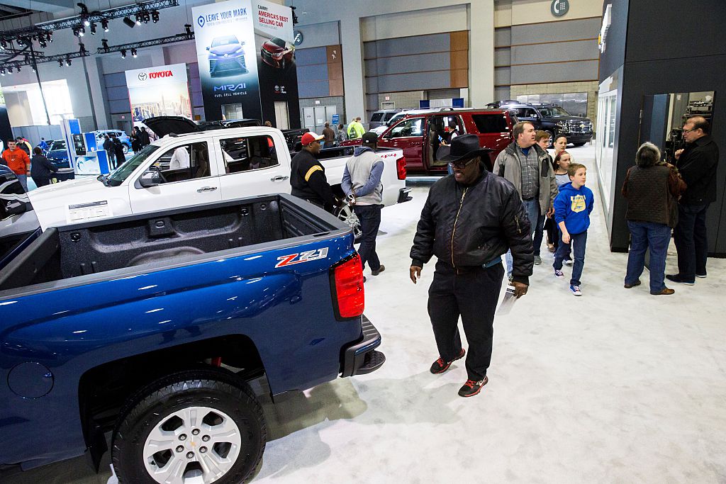 A man looks at the 2016 Chevrolet Silverado 1500 truck