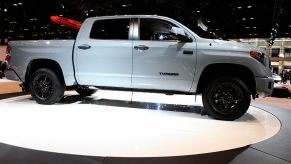 A dependable 2016 Toyota Tundra pickup truck on display at an auto show.