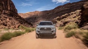The Toyota Tacoma off-roading on a dirt road