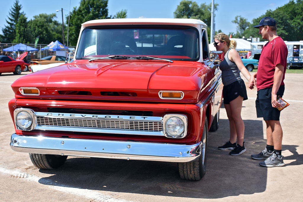 Event attendees check out a vintage Chevrolet pickup truck