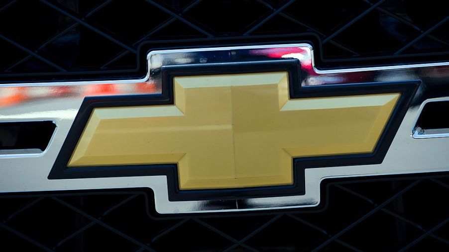 The Chevrolet logo on the front of a Silverado.