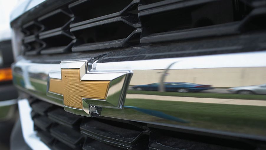 A closeup of a Chevy truck for sale at a dealership