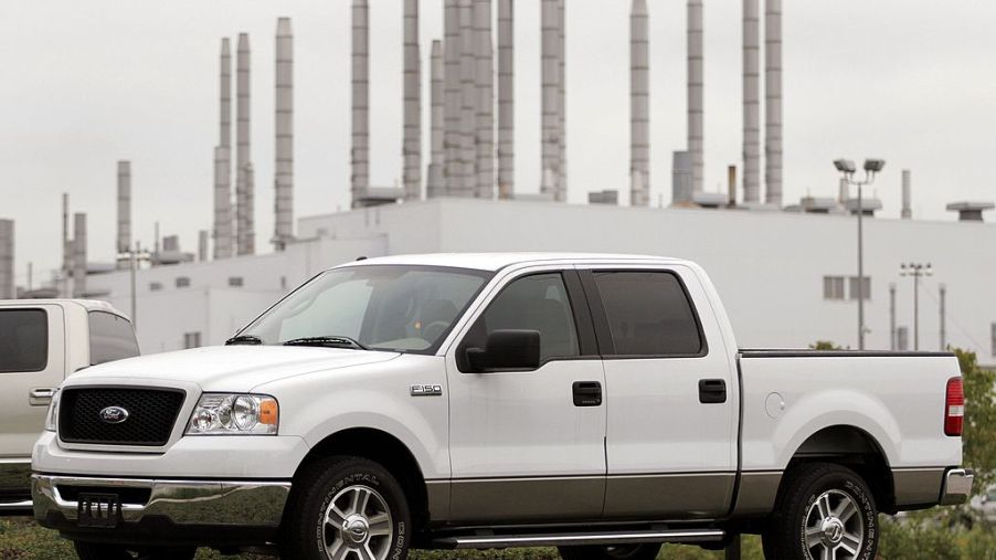 A white Ford F-150 Crew Cab truck on display.