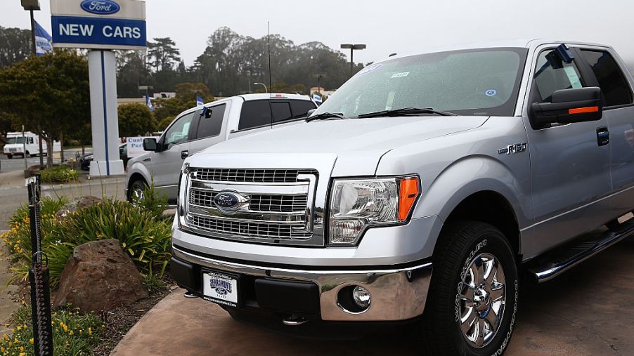 A new Ford F-150 for sale on a dealership lot.