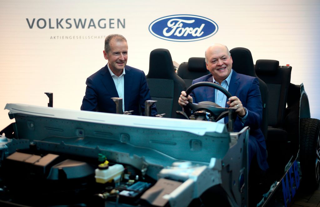 Ford and Volkswagen CEOs pose for a photo