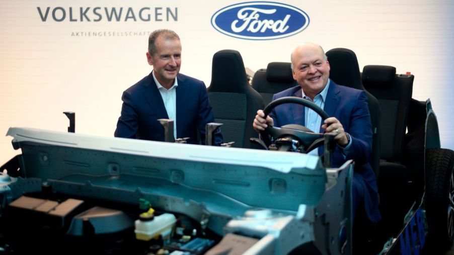Ford and Volkswagen CEOs pose for a photo