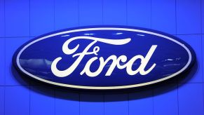 A Ford logo displayed at an auto show.