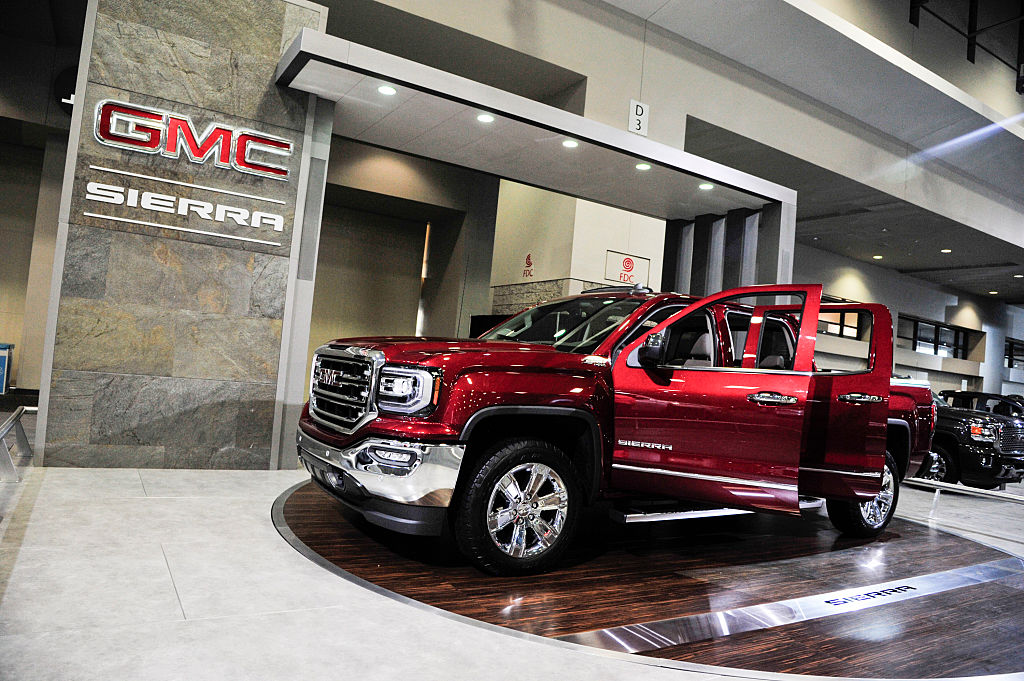 A GMC Sierra on display at an auto show.