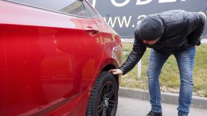VOLGOGRAD, RUSSIA - NOVEMBER 19, 2016: A client looks at a used car for sale at the AGAT Profi dealership. Dmitry Rogulin/TASS (Photo by Dmitry RogulinTASS via Getty Images)