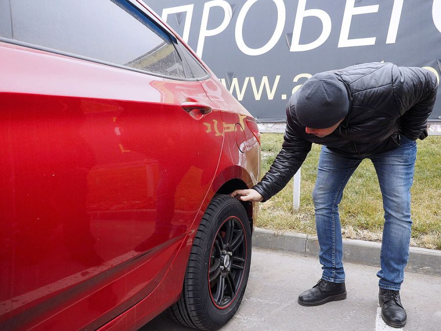VOLGOGRAD, RUSSIA - NOVEMBER 19, 2016: A client looks at a used car for sale at the AGAT Profi dealership. Dmitry Rogulin/TASS (Photo by Dmitry RogulinTASS via Getty Images)