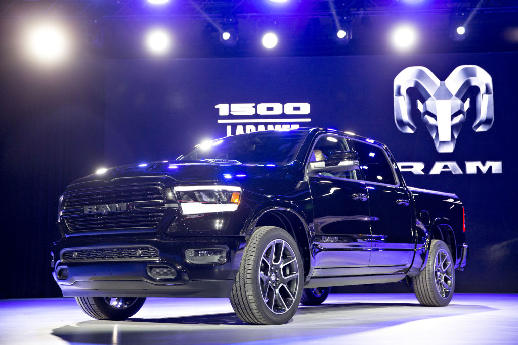 A Ram 1500 pickup truck on display at an auto show.