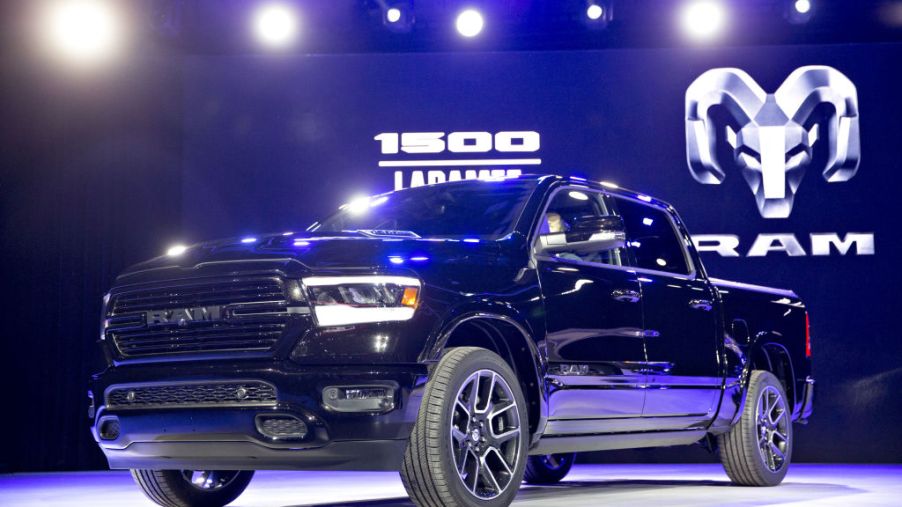 A Ram 1500 pickup truck on display at an auto show.
