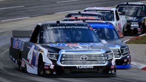 A Toyota Tundra races around the track during a NASCAR truck series event.