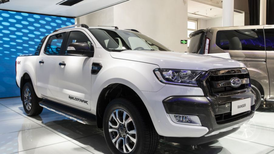 A white Ford Ranger truck on display at an auto show