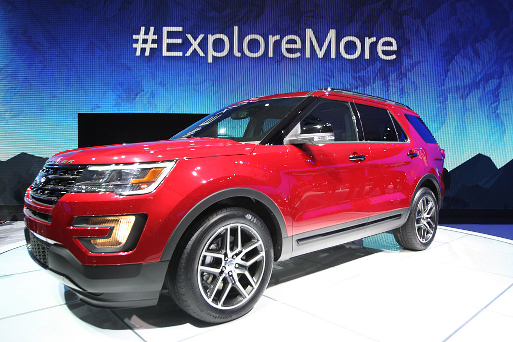 A red 2016 Ford Explorer on display at an auto show