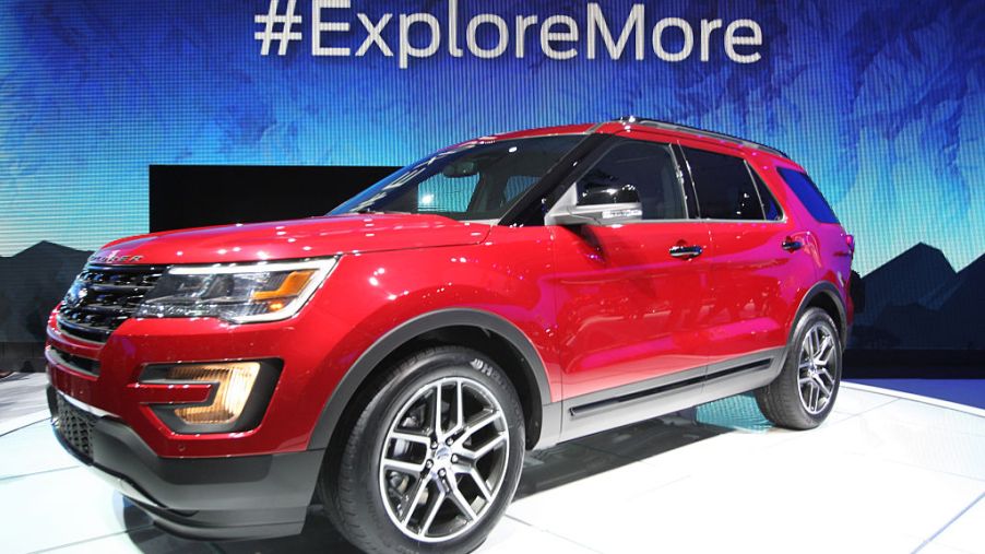 A red 2016 Ford Explorer on display at an auto show