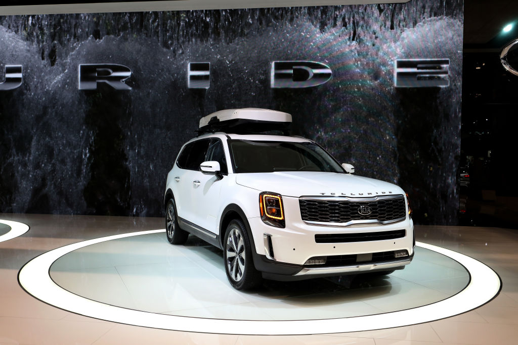 Kia's 3 row SUV, the Telluride on display at an auto show.