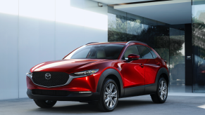 A red 2020 Mazda CX-30 parked near a wall