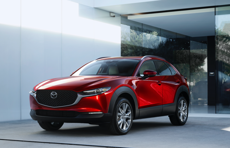 A red 2020 Mazda CX-30 parked near a wall