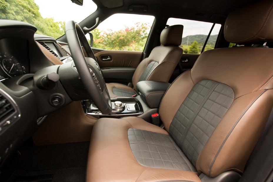 the front row interior of a 2020 Nissan Armada with brown leather