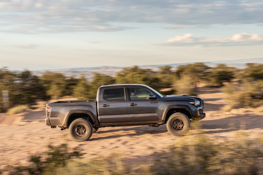 The 2020 Toyota Tacoma TRD Pro in Magnetic Gray races through the desert.