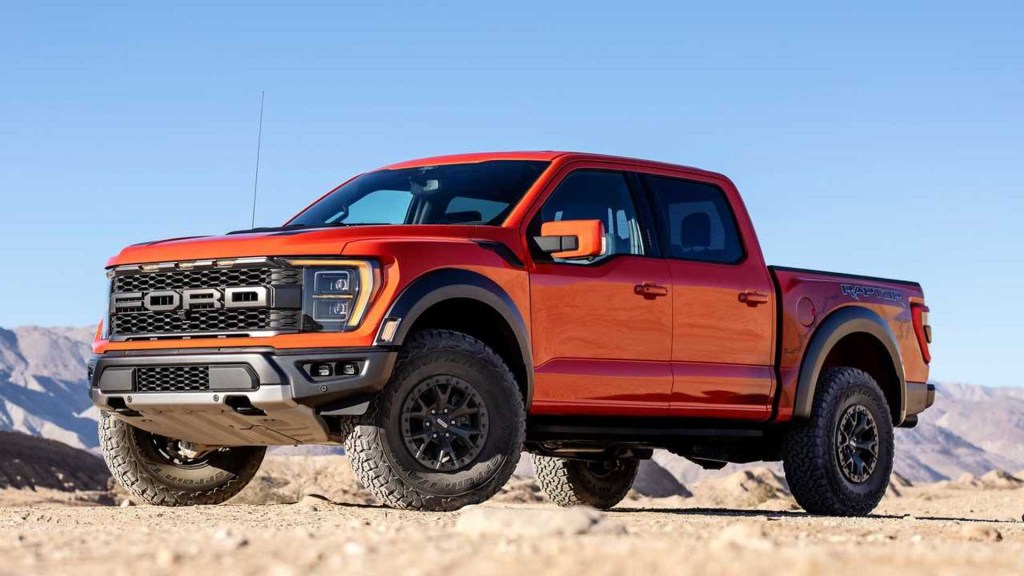 the 2023 Ford F-150 Raptor off-roading in sand