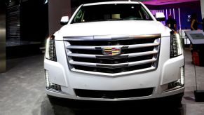 A Cadillac Escalade on display at an auto show