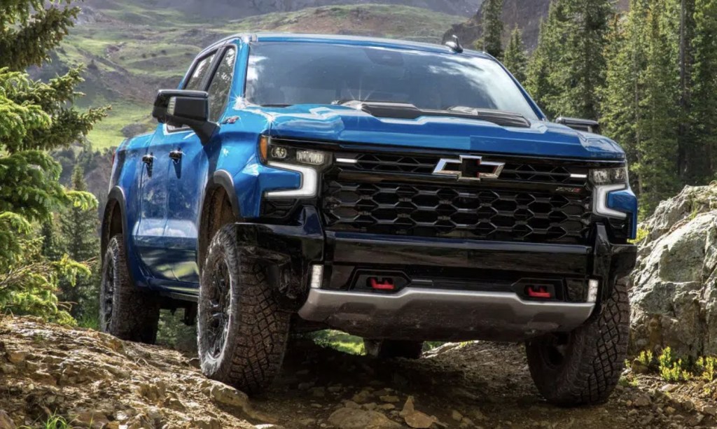 The 2023 Chevy Silverado off-roading over rocks