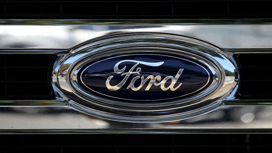 The Ford logo on the front of a pickup truck