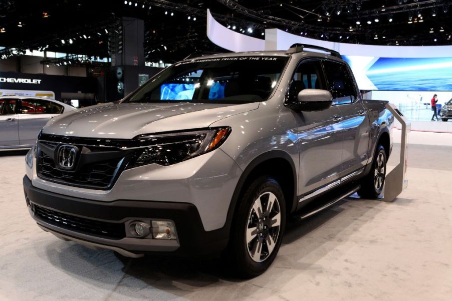 A Honda Ridgeline on display at an auto show.