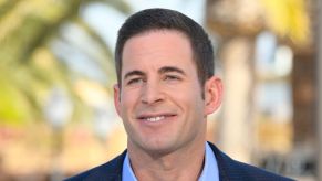 Tarek El Moussa smiles for a press photo
