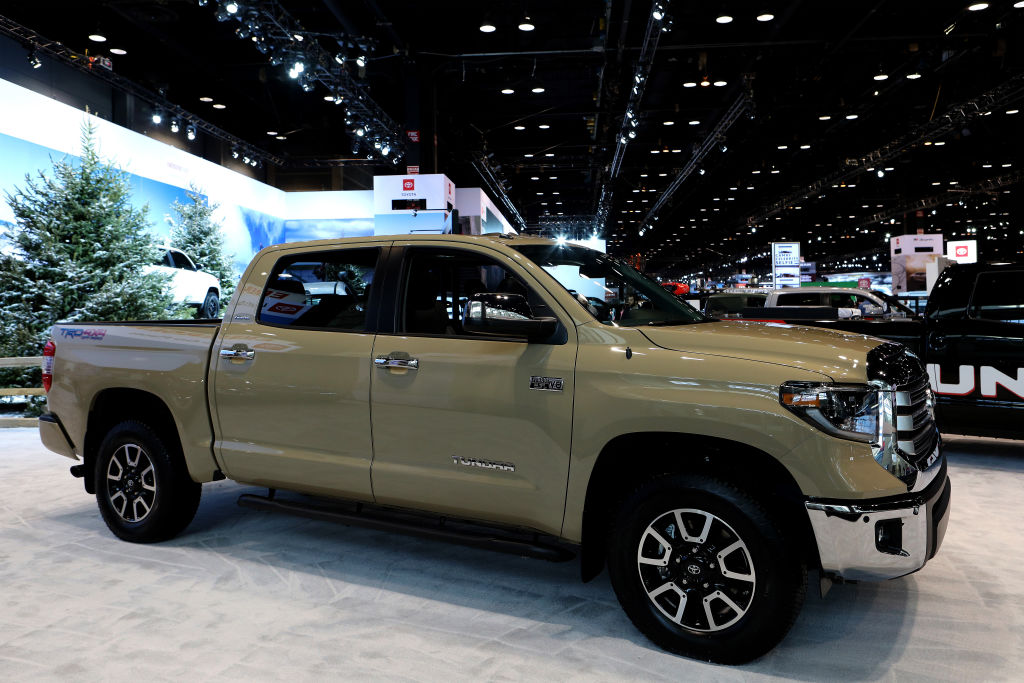 A new Toyota Tundra on display at an auto show. These capable trucks are known for dependability.