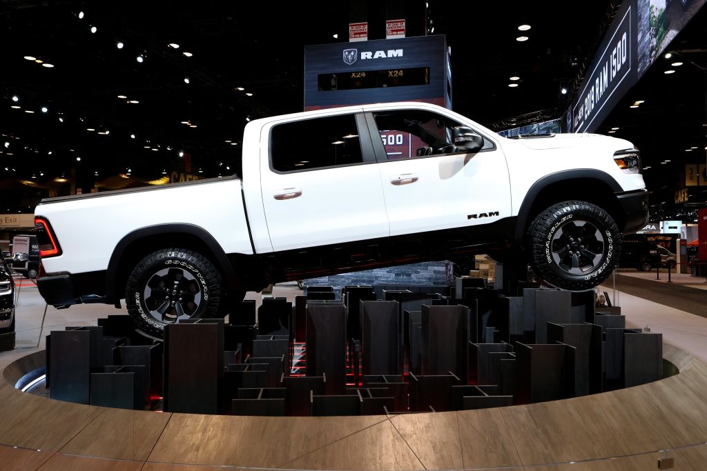 A white Ram 1500 on display at an auto show.