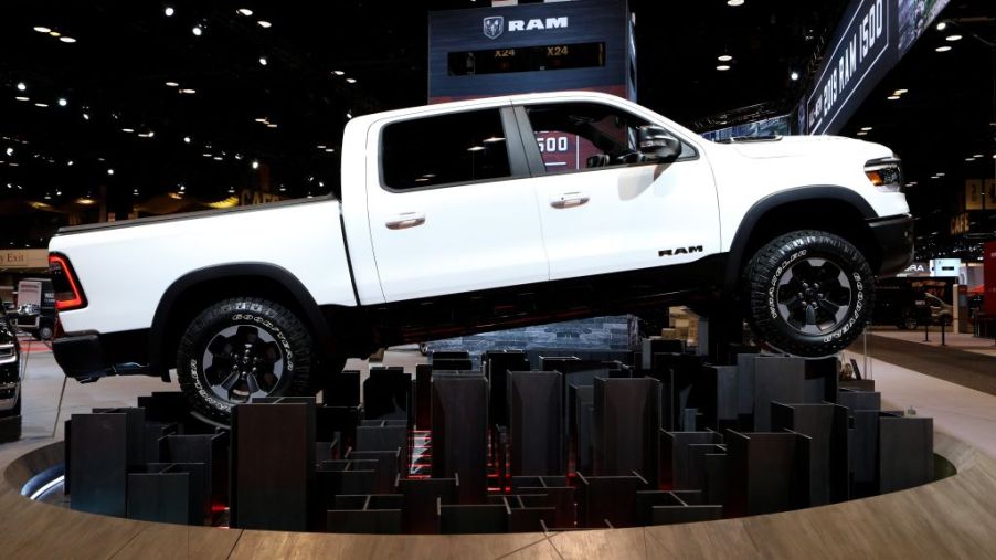 A white Ram 1500 on display at an auto show.
